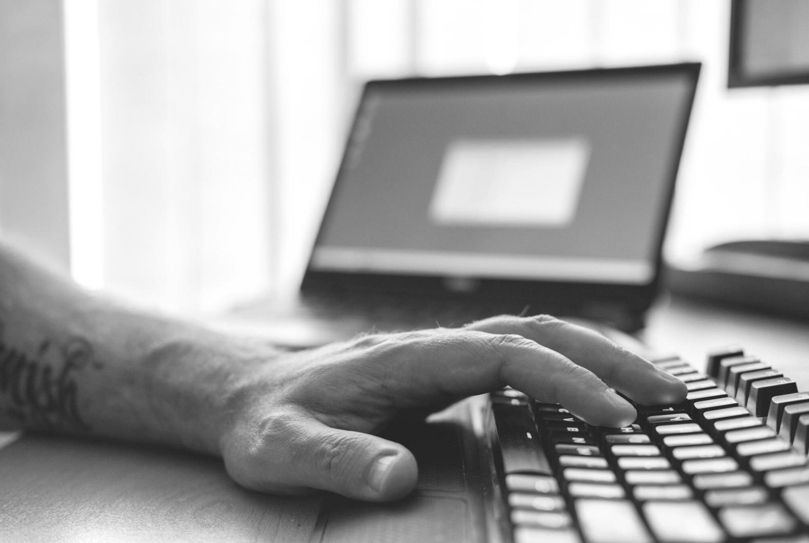 Students collaborating on front-end development projects in classroom setting